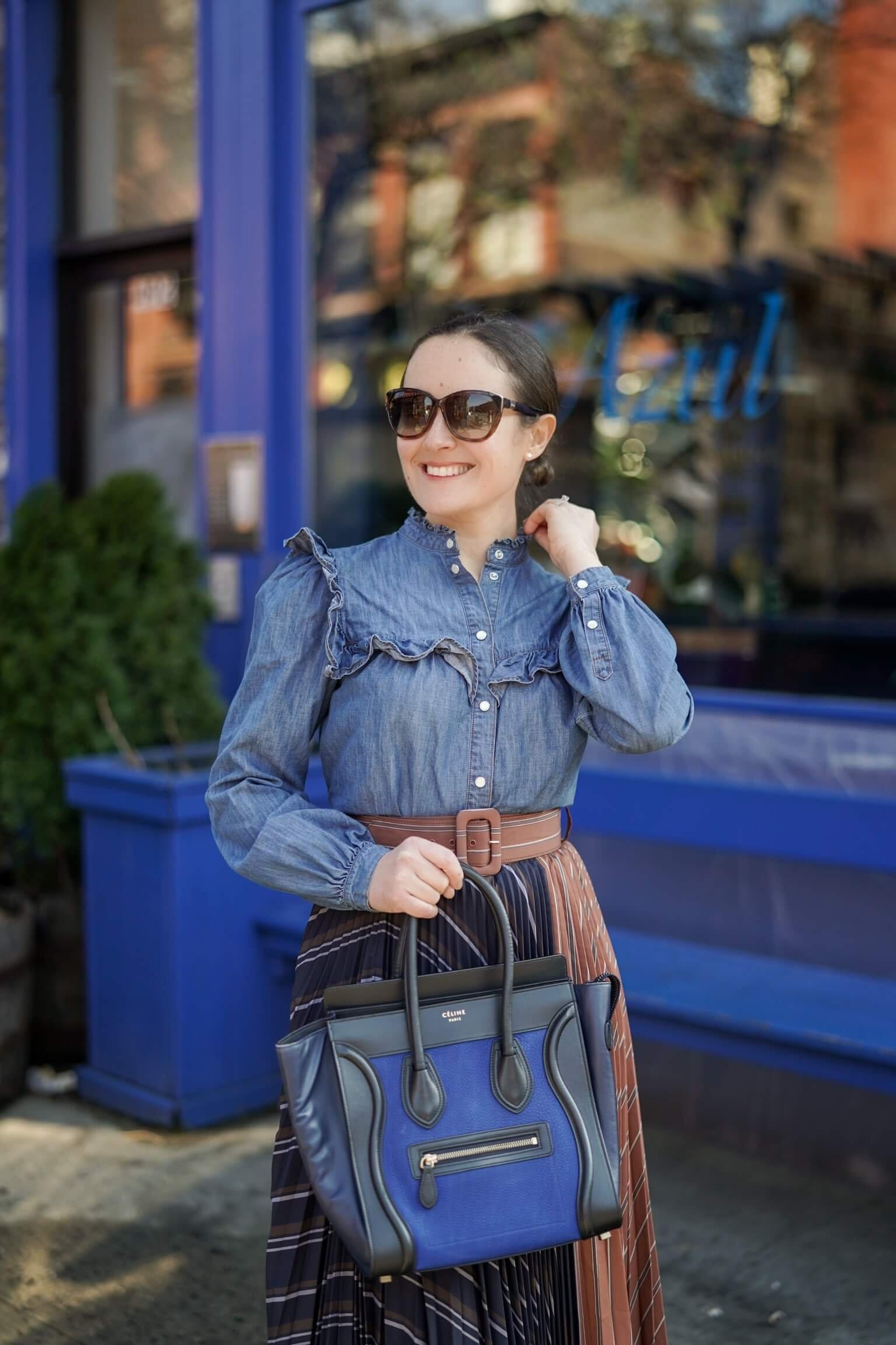 Anthropologie Pleated Skirt Veronica Beard Denim Shirt Coclico Booties Celine Luggage Bag Outfit by Modnitsa Styling