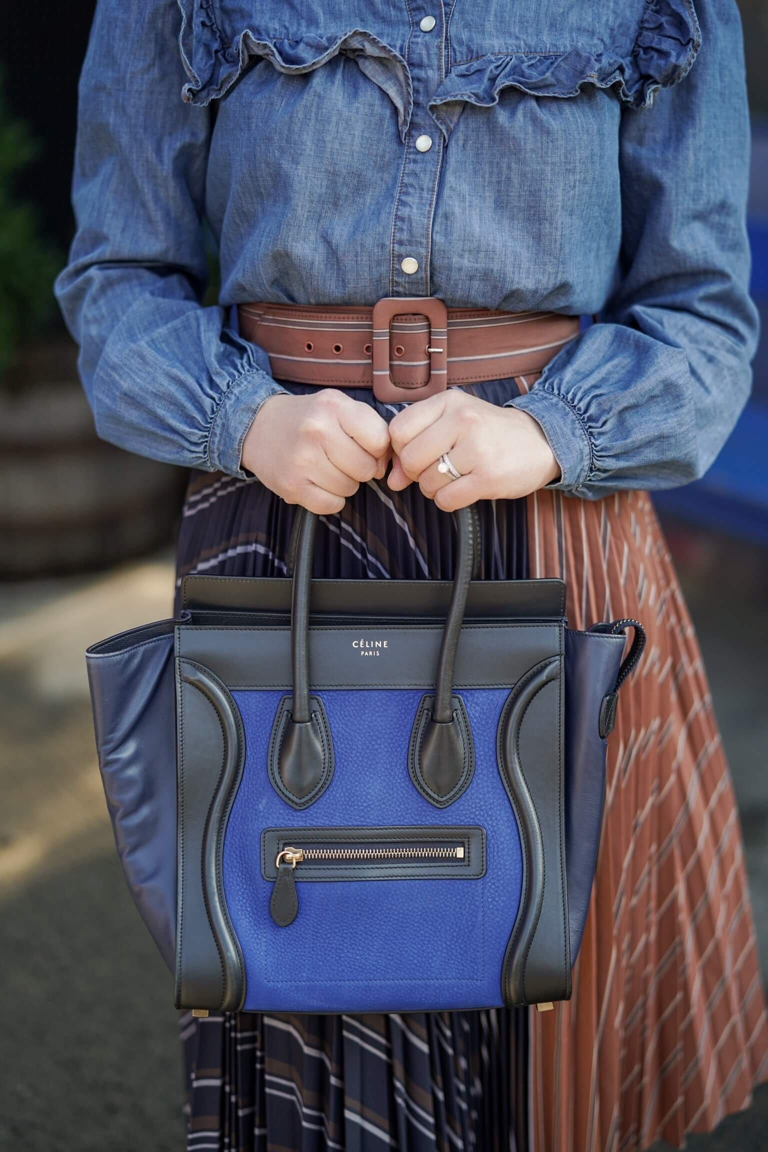 Anthropologie Pleated Skirt Veronica Beard Denim Shirt Coclico Booties Celine Luggage Bag Outfit by Modnitsa Styling